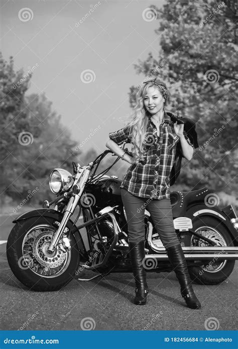 Black And White Photo Of Beautiful Biker Women Posing With Motorcycle
