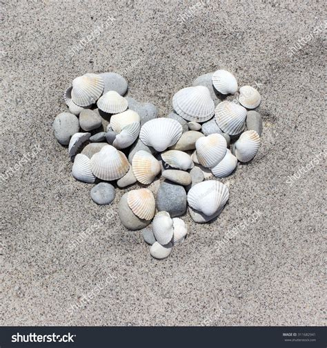 Heart Made Shells Pebbles Sand Beach Stock Photo 311682941 Shutterstock