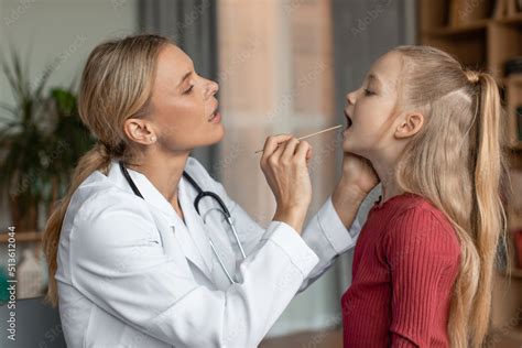 Angina Tonsillitis Cold And Flu In Children Concept Female Doctor