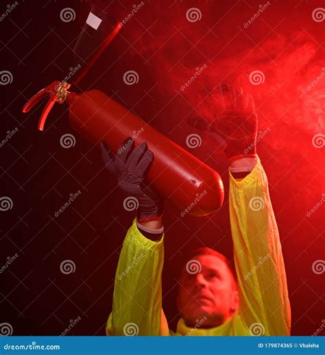 Fireman Attacking A Fire With Extinguisher Stock Image Image Of Adult Service 179874365