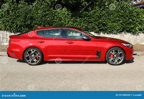 New Red Kia Stinger Gt At The Roadside Side View Editorial Image