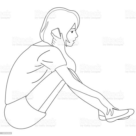 A Young Girl Is Talking On The Phone And Hugging Her Legs Stock