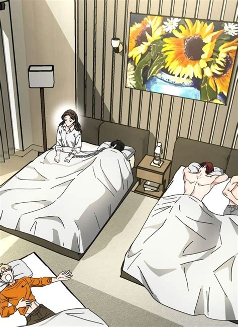 Two Beds In A Room With Sunflowers On The Wall And One Person Laying Down