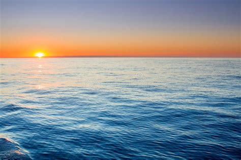 Quiet Sunrise In Open Sea With Calm Clear Sky Stock Image Image Of