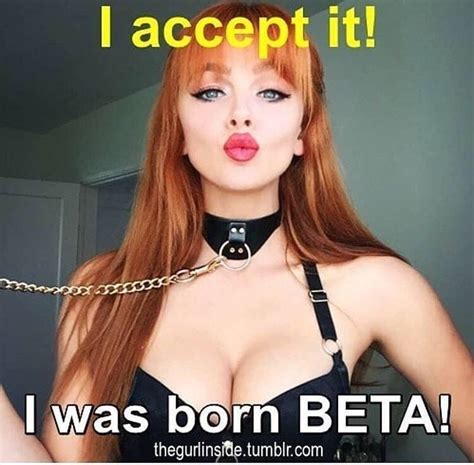 A Woman With Red Hair Wearing A Black Bra And Chain Around Her Neck Has The Caption I Was Born Beta