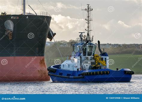 Tugboat Towing Cargo Ship Editorial Stock Photo Image Of Harbor