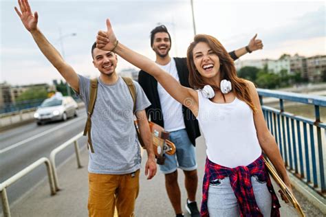 Group Of Happy Teen People Hang Out Together And Enjoying Skateboard