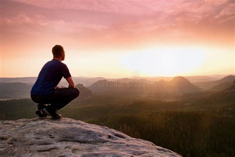 Moment Of Loneliness Man Sit On Rock Peak Enjoy Daybreak Stock Image
