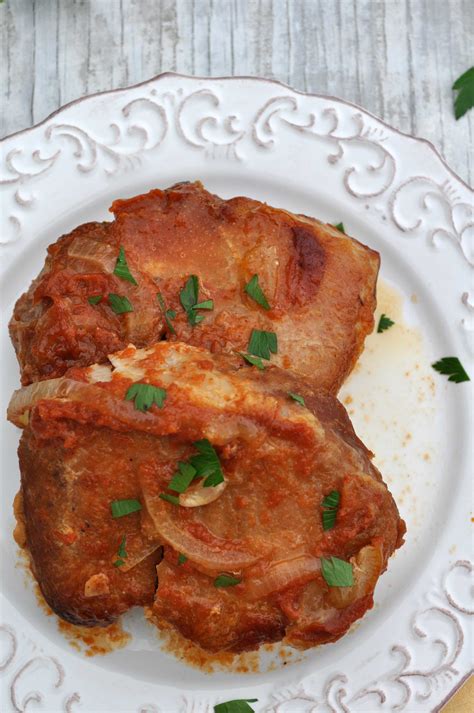 Season the pork with salt and pepper. Slow Cooker Saucy Pork Chops - The Seasoned Mom