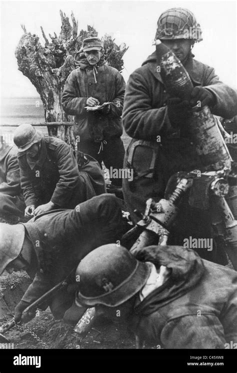 German Soldiers Bombard Russian Positions With A Mortar 1944 Stock
