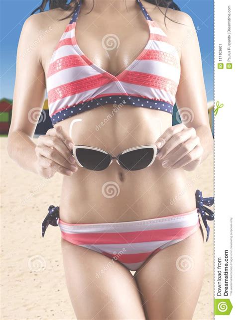 Woman In Swimsuit Holds Sunglasses Stock Image Image Of Healthy