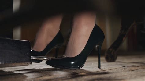 A Woman Plays Piano In The Concert Hall Close Up Of Feet In Shoes
