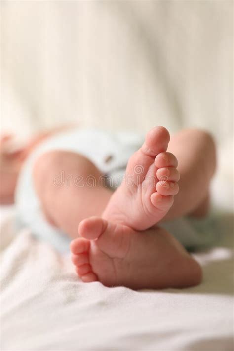 Cute Newborn Baby Lying On Bed Closeup Of Legs Stock Image Image Of