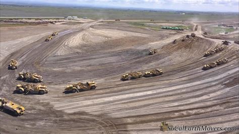 Digging New Landfill Cell With Fleet Of Caterpillar Scrapers Part 2
