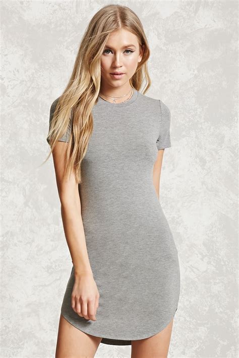 A Knit T Shirt Mini Dress Featuring A Scoop Neckline Curved Hem And Short Sleeves Mini