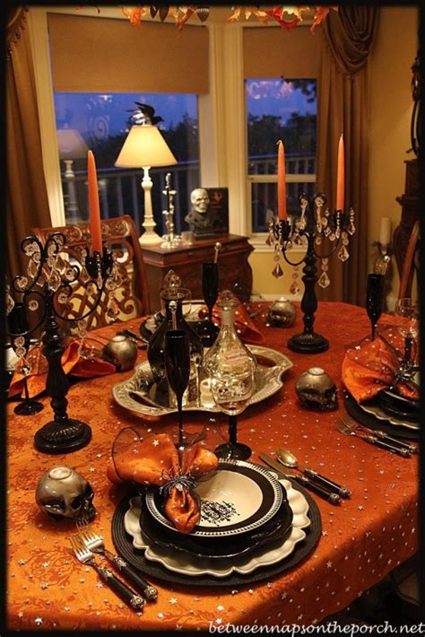 Create an elegant and memorable dinner party table with tall vases filled with flowers. Halloween Tablescape: Elegant & Eerie