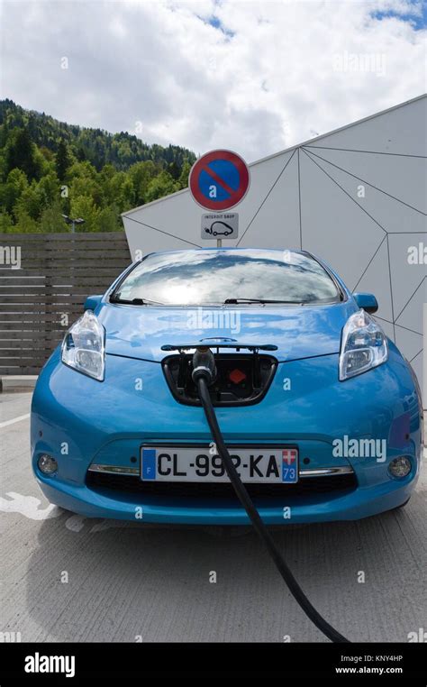 Nissan Leaf Electric Car Being Charged At A Public Charging Point