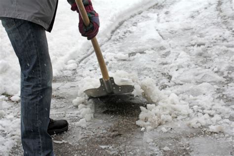 Man Shoveling Snow From This Driveway Or Sidewalk Stock Photo