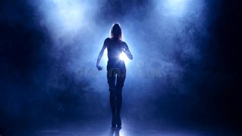 Slender Blonde In Leather Lingerie Dances Silhouette On Smoky