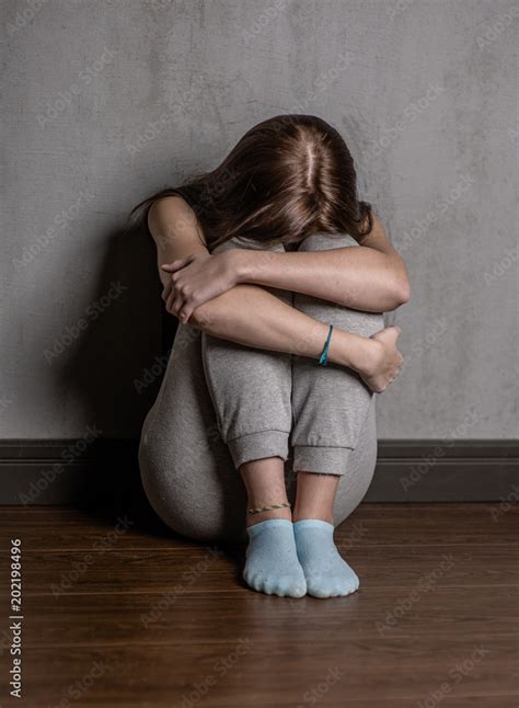 Sad Teen Girl Hug Her Knee And Cry Stock Photo Adobe Stock