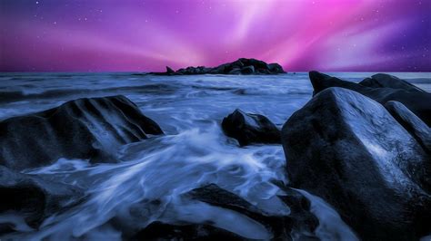 Pink And Starry Night Sky Over Ocean