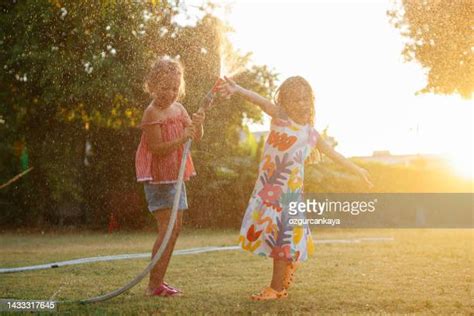 two girls taking shower together photos and premium high res pictures getty images