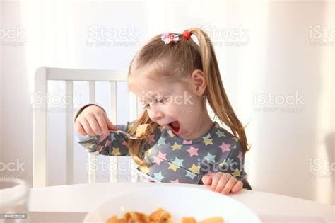 Girl Eating With Appetite Stock Photo Download Image Now Eating