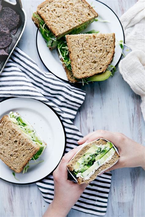 A Green Sandwich Bursting At The Seams With Herbed Goat Cheese Avocado