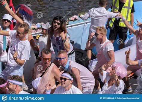 femke halseman on the gemeente amsterdam boat at the gaypride canal parade with boats at