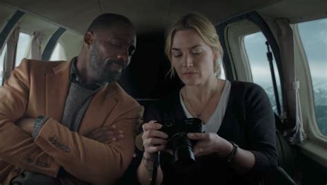 Watch Idris Elba And Kate Winslet Survive A Plane Crash Together In The Trailer For “the