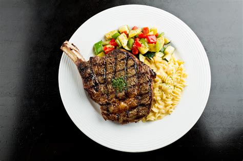 We are known for our salad bar with many fresh items to choose from. Rib Eye Steak With Macaroni And Cheese Stock Photo ...