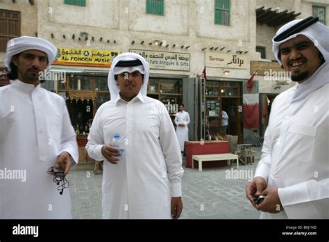 Qatari Men In Traditional Attire At The Souq Waqif Market In Doha