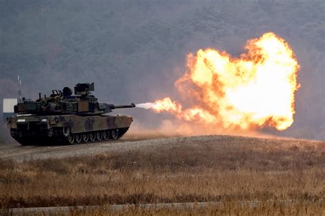 Soldiers Fire Main Weapon Of An M1a2 Abrams Tank During A Gunnery