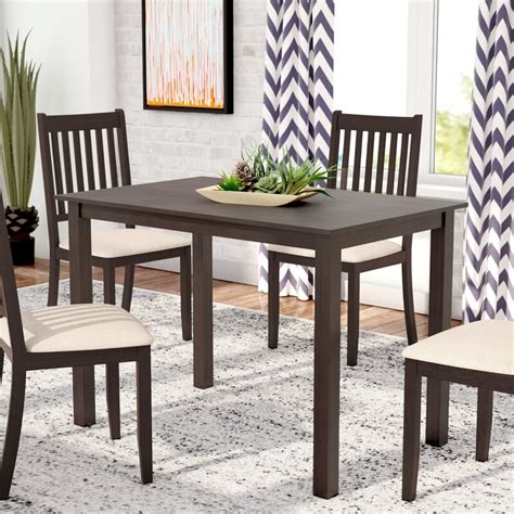 Two small extensions disappear under the table top when not needed. Latitude Run Dining Table & Reviews | Wayfair
