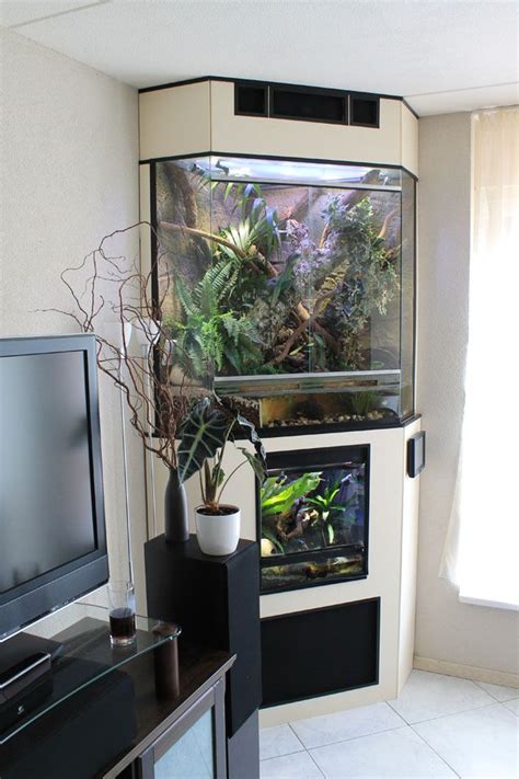 A Fish Tank Sitting On Top Of A Table Next To A Tv