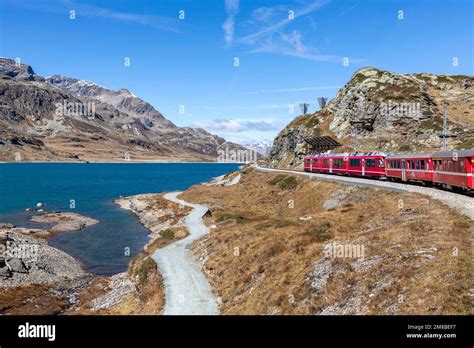 Bernina Express Mountain Railway Train Passing Lago Bianco Stock Photo