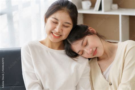 happy lgbtq asian lesbian couple two asian girls show their love by cuddling and having romance