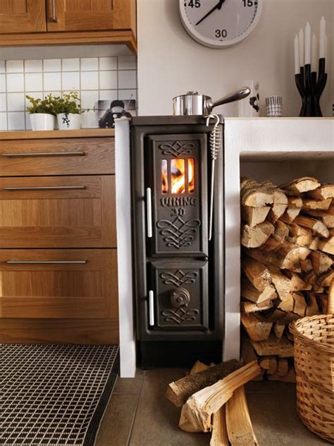 Scandinavian modern dining table photo credit: Scandinavian wood burning stove. love it. - Futura Home Decorating