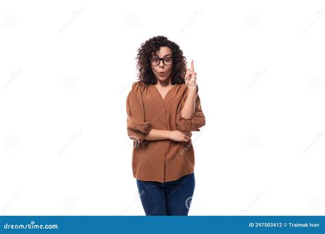 Portrait Of A Young Stylish Slim Brunette Woman With Curly Hair Dressed