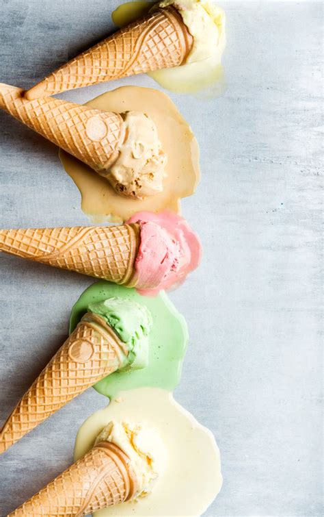 Colorful Ice Cream Cones Of Different Flavors Melting Scoops Top View Steel Metal Background