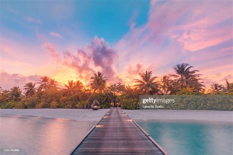 Beautiful Sunset Beach Scene Colorful Sky And Clouds View With Calm Sea