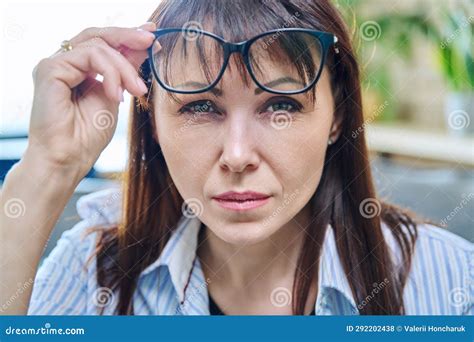 Close Up Of The Face Of Mature Woman In Glasses An Attentive Looking