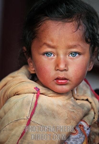 Portrait Of A Nepali Child With Amazing Eyes In The Hills Of East Nepal