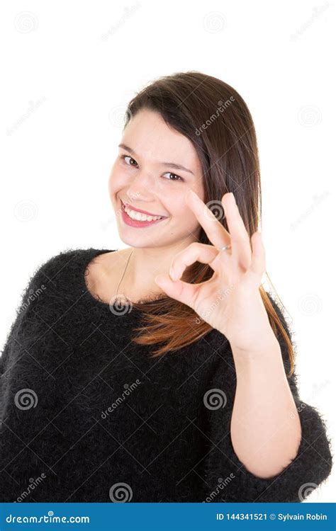 Portrait Of Happy Young Woman Showing Ok Sign Finger Gesture Stock