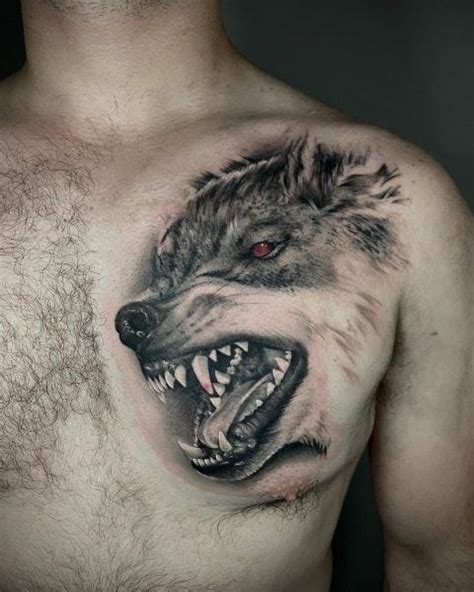 A Man With A Wolf Tattoo On His Chest