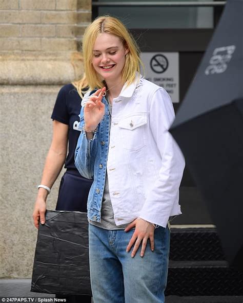 Elle Fanning Flashes Her Midriff While Posing Up A Storm On Streets Of