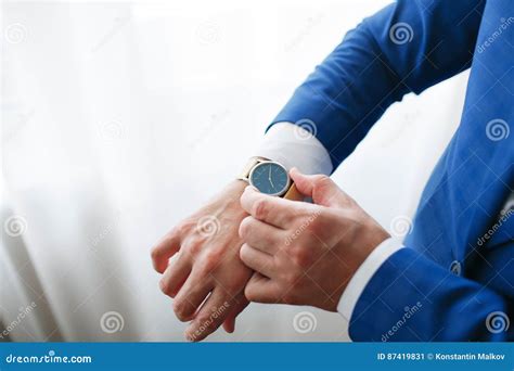 Businessman Checking Time On His Wristwatch Men`s Hand With A Watch