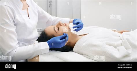 Brunette Woman Gets Mechanical Cleansing Facial Skin From Defects And
