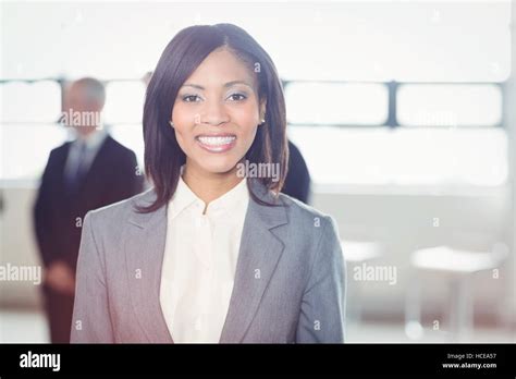 Attractive Businesswoman Smiling At Camera Stock Photo Alamy