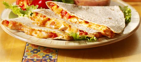 Unraveling the mysteries of home cooking mixing the cheese in with the fillings distributes it evenly and ensures that the quesadilla fillings stay. Cheesy Chicken Quesadillas recipe | Dairy Goodness